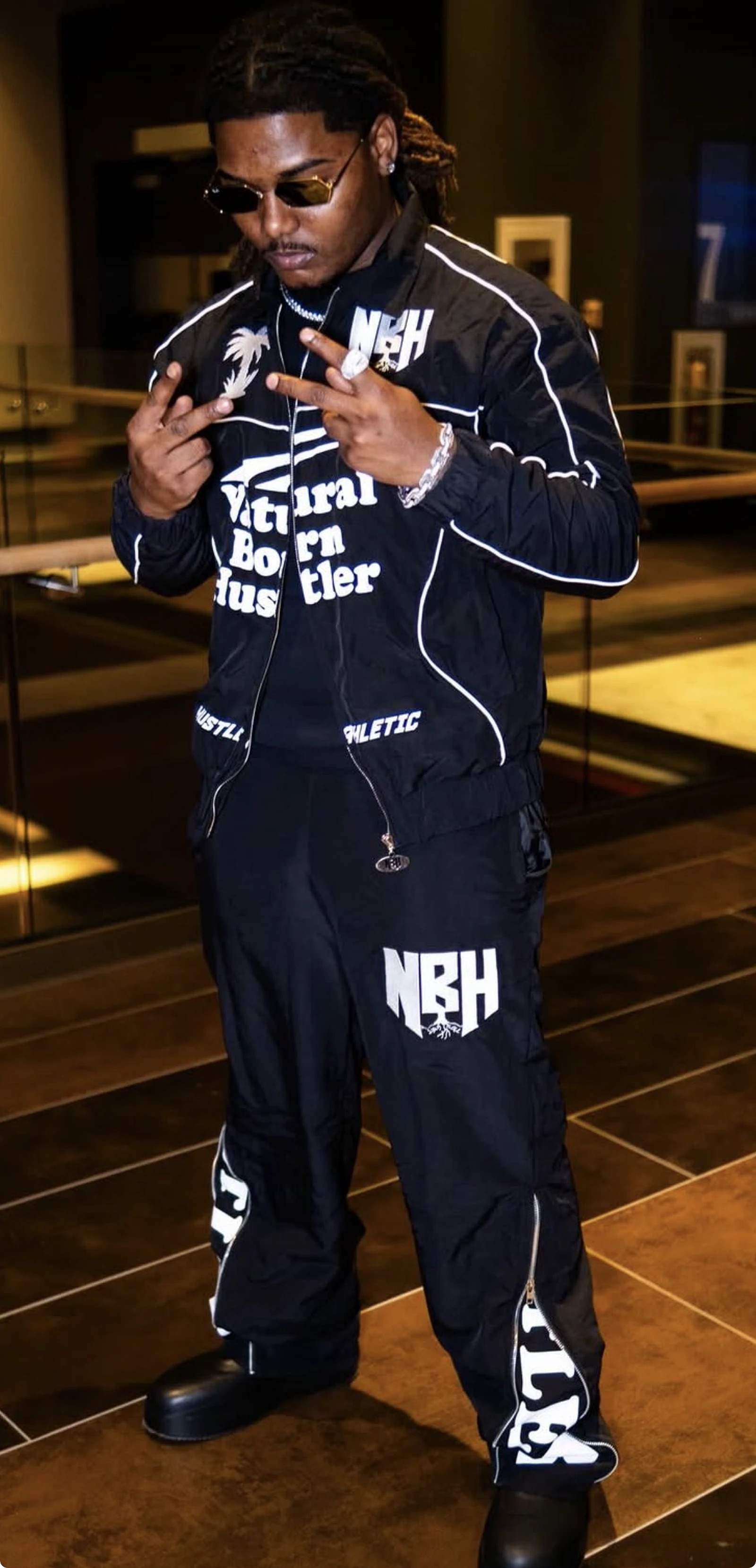 Artist wearing a full NBH Studios branded performance set